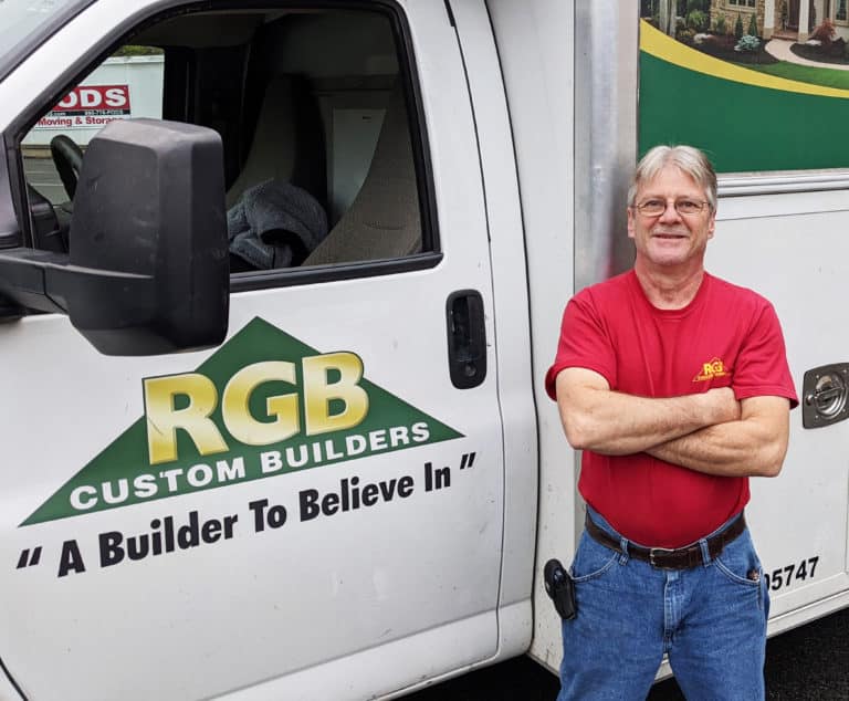 Photo of Phil next to RGB truck