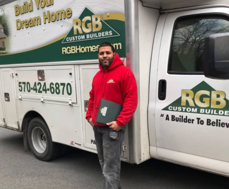 Photo of Tyrone next to RGB truck