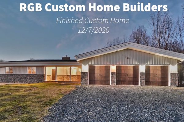 RGB Custom Home Exterior, single story home with 3-car garage and solar array on roof